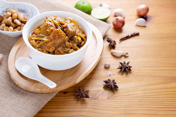 Red curry or Pork curry on wood table soft background, thai food, india food, Thai Food name Hung Ley