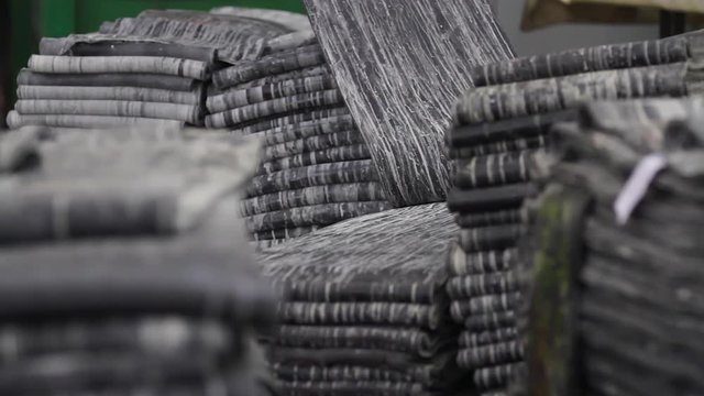 Rubber band before molding at a tire factory. Rubber tape on a large tire factory close-up. Recycling rubber in a large enterprise. Recycling and waste of the chemical industry. Refinery waste.