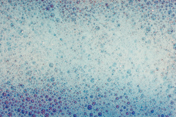 Soap bubbles background- suds liquid