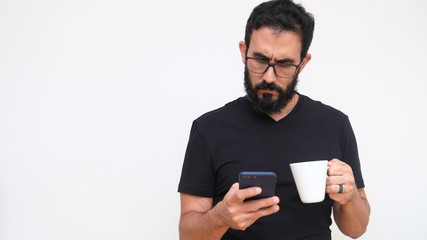 Middle age man in a white backround holding a cup of coffee 