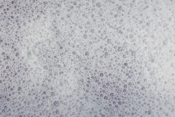 Soap bubbles background- suds liquid