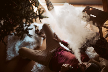 Trendy man using a vaper - Christmas