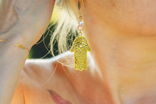 Woman outdoor wearing beautiful boho style earring