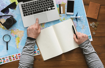 Fototapeta na wymiar Quick plan your trip abroad through the Internet