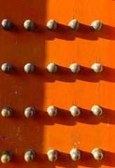 red color old Chinese wood door with metal knob background