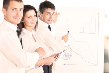 Fototapeta premium work of two young businessmen using touchpad at meeting