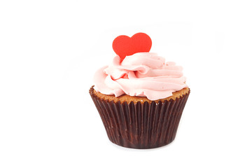 Pink cupcake roses and red heart sugar icing isolated on white background