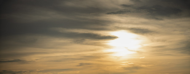 Naklejka na ściany i meble golden skies in a summer sunset panorama