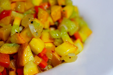 Food Background. Finely Chopped Zucchini, Carrot And Onion Over Black Background. Fried Zucchini, Carrot And Onion.