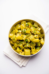 Lauki/doodhi ki sookhi Sabji also known as bottle gourd dry vegetable recipe. served in a bowl or karahi. selective focus
