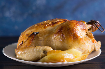 Christmas dinner. Fried chicken. Winter holiday table. Roast Turkey on a wooden background with a Christmas tree, table setting.