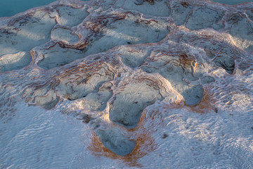Turkey, details of the travertine terraces at Pamukkale (Cotton Castle), natural site of sedimentary rock deposited by water from the hot springs, famous for a carbonate mineral left by flowing water