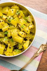 Lauki/doodhi ki sookhi Sabji also known as bottle gourd dry vegetable recipe. served in a bowl or karahi. selective focus