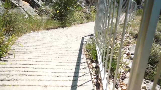 fance on walkway to the beach
