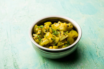 Lauki/doodhi ki sookhi Sabji also known as bottle gourd dry vegetable recipe. served in a bowl or karahi. selective focus