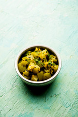 Lauki/doodhi ki sookhi Sabji also known as bottle gourd dry vegetable recipe. served in a bowl or karahi. selective focus