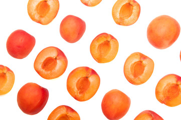 Slices of fresh juicy apricot on a white background. Orange fruit for jam. Sweet vegan healthy food. A lot of apricots.