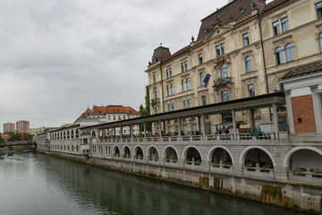 Obraz na płótnie Canvas Ljubljana,Slovenia,6,2016: Street, river, bridges with dragons, magical city.