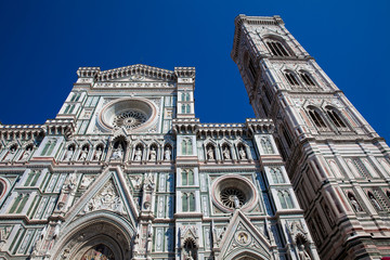Fototapeta premium The Giotto Campanile and Florence Cathedral consecrated in 1436 against a beautiful blue sky