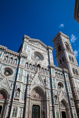 The Giotto Campanile and Florence Cathedral consecrated in 1436 against a beautiful blue sky