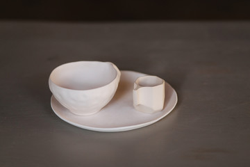 Ceramic cup for tea coffee and plate on the table