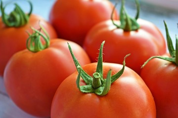 Delicious,ripe tomatoes on a wooden background.Healthy diet.