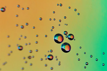 beautiful vials of air in water on a multi-colored background.The texture of water on the glass