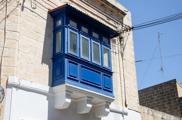 Fototapeta na wymiar Maltese blue covered balcony in Valletta