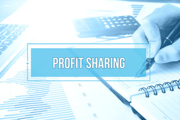 Hand writing on blank notebook with text PROFIT SHARING