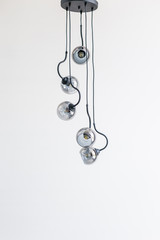 Fototapeta na wymiar Modern glass chandelier in the shape of balls