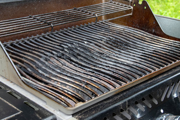 used bbq applicance grill at house exterior
