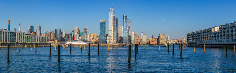 View to Manhattan skyline from Weehawken Waterfront in  Hudson River at sunset.