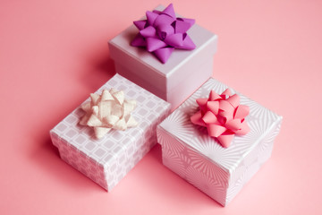 Gift boxes on pink background.