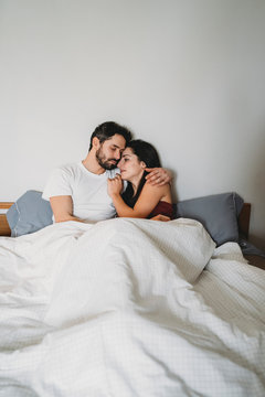Young romantic couple in bed