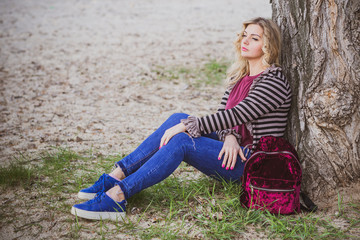  Nice European or American plump girl at park, concept of modern women lifestyle, walk in autumn...
