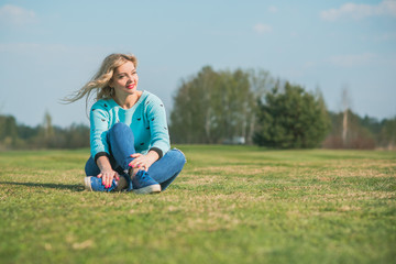 Fototapeta premium Nice European or American plump girl at park, concept of modern women lifestyle, walk in autumn time 