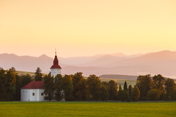 Rural landscape with a church in Turiec region, central Slovakia.
