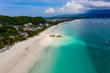 Aerial view of the famous White Beach and Willy's Rock on Boracay island in the Philippines
