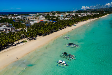BORACAY, PHILIPPINES - 18 JUNE 2019: Sailing boats around the famous White Beach on the island of...