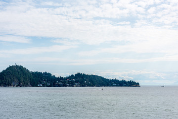 View over Inlet, ocean and island with mountains in beautiful British Columbia. Canada.