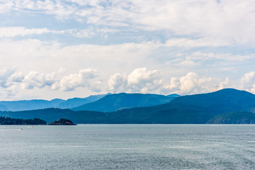 View over Inlet, ocean and island with mountains in beautiful British Columbia. Canada.