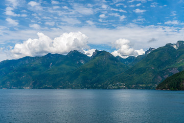 Fototapeta premium View over Inlet, ocean and island with mountains in beautiful British Columbia. Canada.