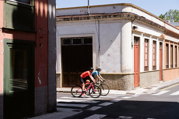 Cyclists riding bicycle on city street