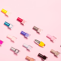 Nail polish bottles pattern background. Close up.