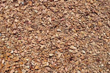 Light brown crushed stone on the track.