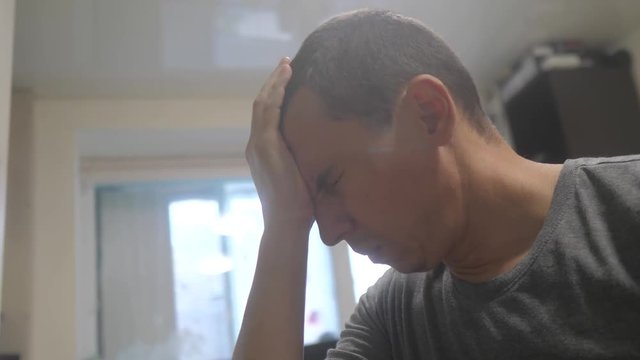 middle-aged man tired big problems at work going through experiencing stress. man unhappy holding his head. depression bankruptcy in the business concept. bankrupt upset because of lifestyle work