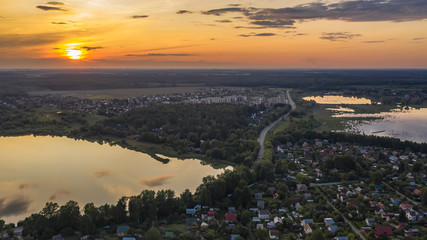Aerial view of the lake in the middle climatic zone , roads and villages surrounding it