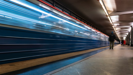 the movement of people on the subway platform when the train arrives