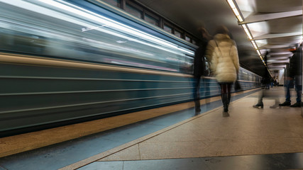 the movement of people on the subway platform when the train arrives