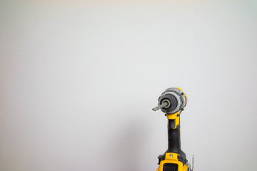 yellow battery drill in White background